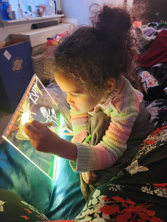 Girl creating glowing designs