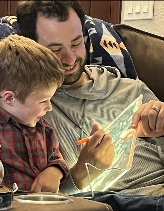 Boy enjoying the LED board